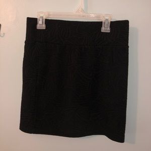 Black mini skirt with flower detailing